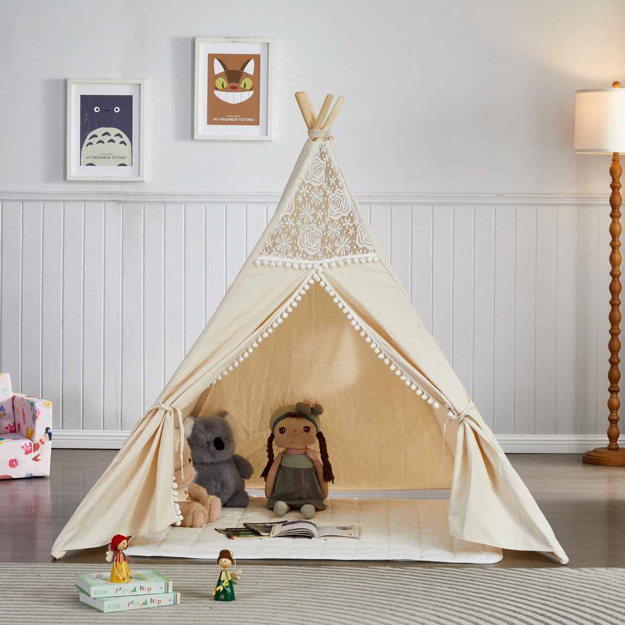 Children's teepee with toys inside in a room setting